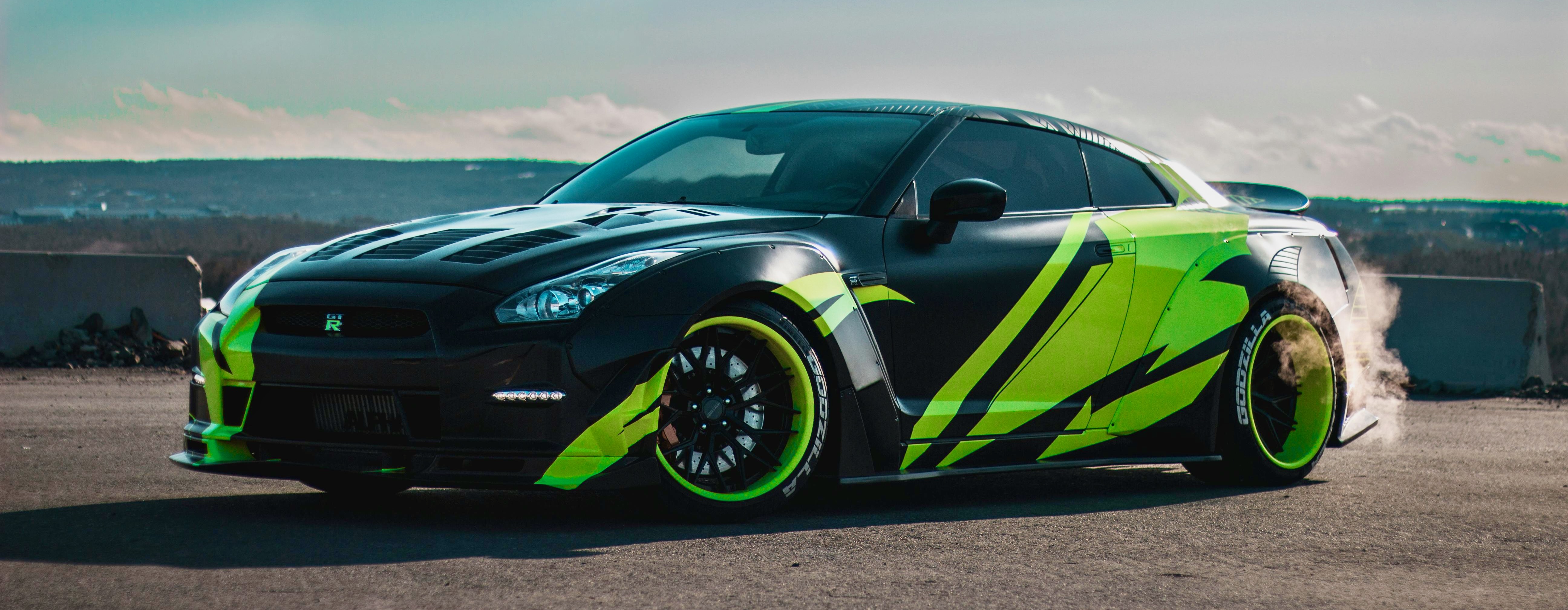 graphic of a black car wrapped in green